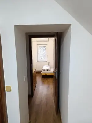 an open door to a room with a bed at Apartmán v blízkosti města Štětí in Štětí