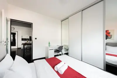 a bathroom with a tub and a toilet and a sink at Penthouse with terrace near the center of Prague in Prague