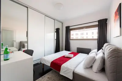 a small bathroom with a toilet and a sink at Penthouse with terrace near the center of Prague in Prague