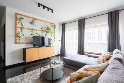 a bedroom with a bed and a large mirror at Penthouse with terrace near the center of Prague in Prague