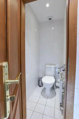 a bathroom with a white toilet in a room at Narodni - Old Town Residence in Prague