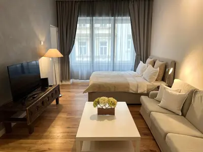 a living room with a bed and a couch at CITY CENTRUM CHARMING apartment in Prague