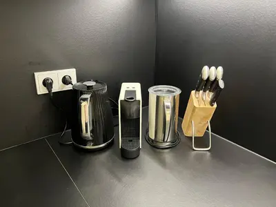 a kitchen counter with appliances on a counter top at CITY CENTRUM CHARMING apartment in Prague