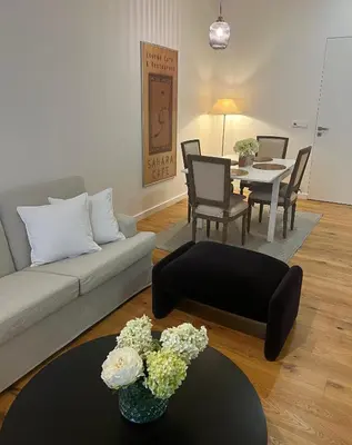 a living room with a couch and a table at CITY CENTRUM CHARMING apartment in Prague