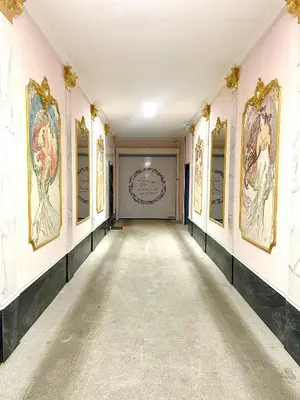 an empty hallway with paintings on the walls at Centrum Bohemia Apartment in Prague