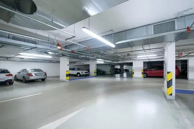 a parking garage with cars parked in it at Centrum Park Studio in Prague
