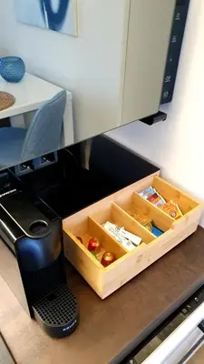 a coffeemaker sitting on a counter with a box of food at LUXURY APARTMENT VBLOKU in Prague