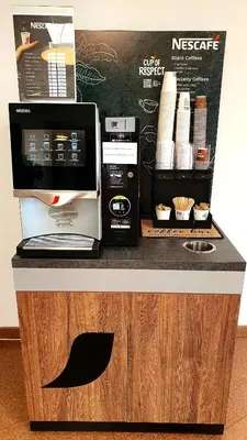 a counter with a computer and a coffee maker on it at LUXURY APARTMENT VBLOKU in Prague