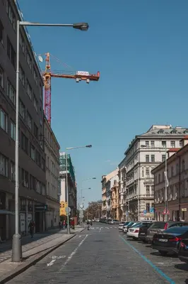 a city street with cars parked on the street at Opletal Apartment Prague in Prague
