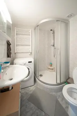a bathroom with a shower and a sink and a toilet at Opletal Apartment Prague in Prague