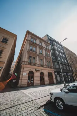 a building with a car parked in front of it at Opletal Apartment Prague in Prague