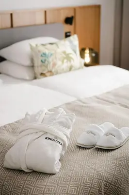 a pair of towels sitting on a bed at Soukenicka Apartments Old Town Prague in Prague
