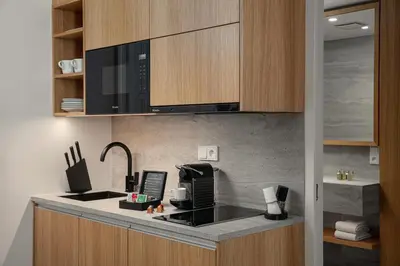 a kitchen with a sink and a microwave at Soukenicka Apartments Old Town Prague in Prague