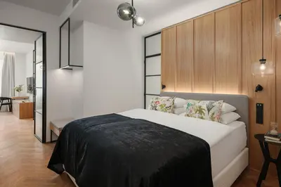 a bedroom with a large bed in a room at Soukenicka Apartments Old Town Prague in Prague