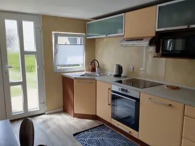 a kitchen with a sink and a stove top oven at Apartmán Marie in Litoměřice