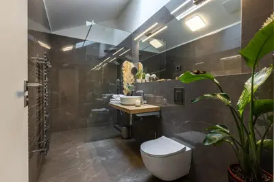 a bathroom with a toilet and a sink at Luxurious, charming studio perfect for couples in Prague