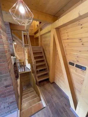 an overhead view of a wooden cabin with stairs in it at Chata Křivoklát in Křivoklát