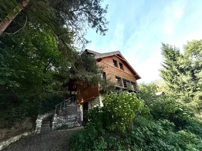 a wooden house sitting on top of a hill at Chata Křivoklát in Křivoklát