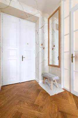 a room with a bench and a mirror at Wabi Sabi Nest w/ Garage in Prague