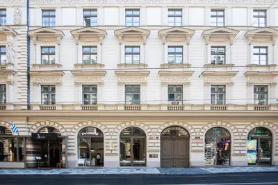 a large white building with arched windows at Wabi Sabi Nest w/ Garage in Prague