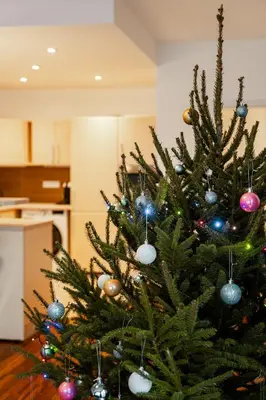 a christmas tree with ornaments on it at AuriApartments Karlín 2KK s terasou a parkováním in Prague