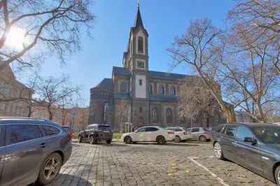 a large building with cars parked in front of it at AuriApartments Karlín 2KK s terasou a parkováním in Prague